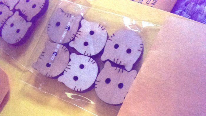 cat head buttons in a packet